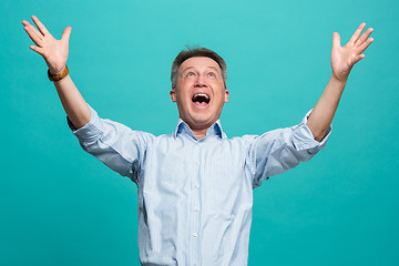 Image showing Winning success man happy ecstatic celebrating being a winner. Dynamic energetic image of male model