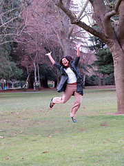 Image showing Young hispanic teen girl jumping in park