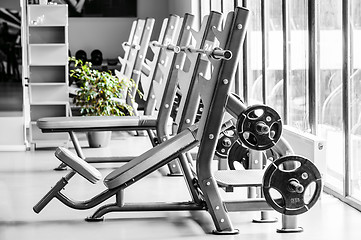 Image showing Modern gym interior with bench press equipment in a raw