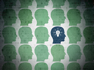 Image showing Finance concept: head with light bulb icon on Digital Data Paper background