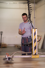 Image showing worker in a factory of wooden furniture