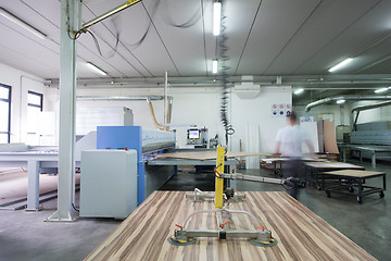 Image showing worker in a factory of wooden furniture