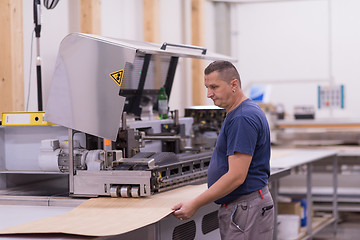 Image showing worker in a factory of wooden furniture