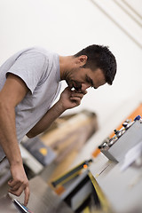 Image showing engineer in front of wood cutting machine