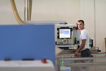 Image showing worker in a factory of wooden furniture