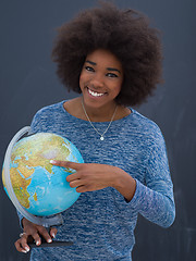 Image showing black woman holding Globe of the world