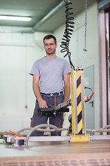 Image showing worker in a factory of wooden furniture