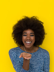 Image showing black woman isolated on a Yellow background