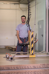 Image showing worker in a factory of wooden furniture