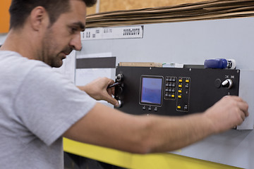 Image showing worker in a factory of wooden furniture