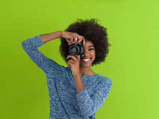 Image showing black girl taking photo on a retro camera