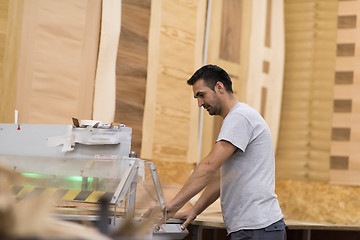 Image showing worker in a factory of wooden furniture