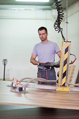 Image showing worker in a factory of wooden furniture