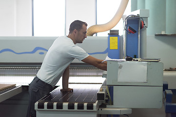 Image showing worker in a factory of wooden furniture