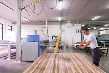 Image showing worker in a factory of wooden furniture