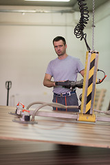 Image showing worker in a factory of wooden furniture