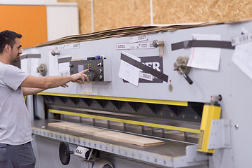 Image showing worker in a factory of wooden furniture