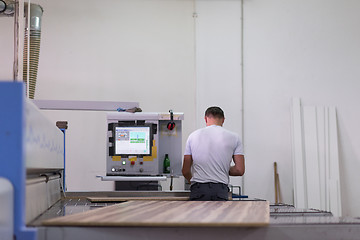 Image showing worker in a factory of wooden furniture