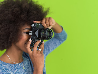 Image showing black girl taking photo on a retro camera