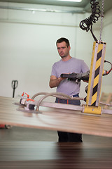 Image showing worker in a factory of wooden furniture