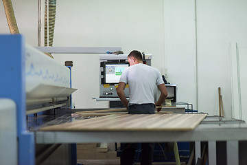 Image showing worker in a factory of wooden furniture