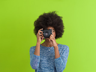 Image showing black girl taking photo on a retro camera