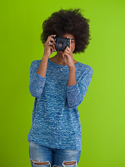 Image showing black girl taking photo on a retro camera