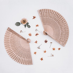 Image showing Elegant wooden fans and dried flowers