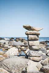 Image showing Stack of stones on a rocky beach