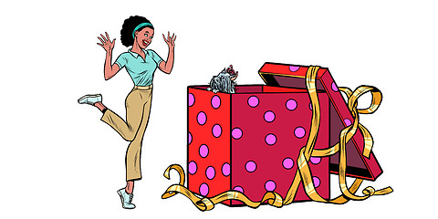 Image showing dog puppy holiday gift box. African woman funny reaction isolate on white background