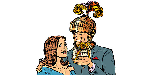 Image showing man knight gives a woman a castle. isolate on white background