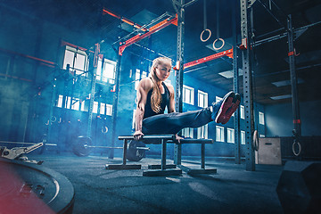 Image showing Concept: power, strength, healthy lifestyle, sport. Powerful attractive muscular woman at CrossFit gym