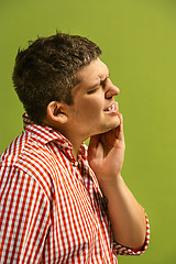 Image showing Young man is having toothache.