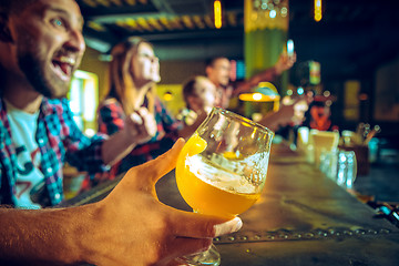 Image showing Sport, people, leisure, friendship and entertainment concept - happy football fans or male friends drinking beer and celebrating victory at bar or pub