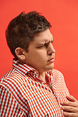 Image showing Young man overwhelmed with a pain in the heart