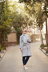 Image showing Young blond woman with sunglases on the street