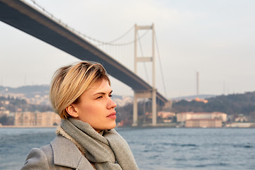 Image showing Portrait of a young woman under the Bosporus bridge.
