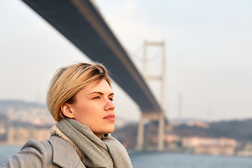 Image showing Portrait of a young woman under the Bosporus bridge.