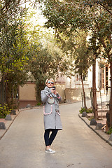 Image showing Pretty blonde taking a selfie on a spring day