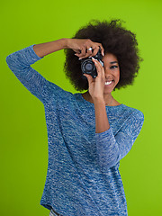 Image showing black girl taking photo on a retro camera