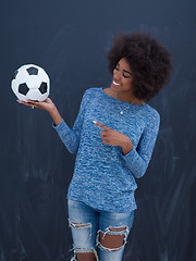 Image showing black woman holding a soccer bal
