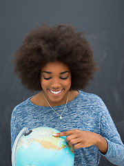 Image showing black woman holding Globe of the world