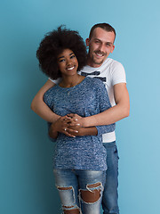 Image showing multiethnic couple laughing and hugging