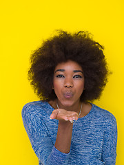 Image showing black woman isolated on a Yellow background