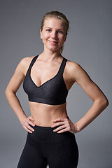 Image showing Sport athletic woman standing with hands on hips