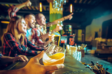 Image showing Sport, people, leisure, friendship and entertainment concept - happy football fans or male friends drinking beer and celebrating victory at bar or pub