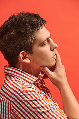 Image showing Young serious thoughtful businessman. Doubt concept.