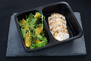 Image showing Poultry fillet on a salad with sugar peas and oranges. Balanced box diet, dinner dish.