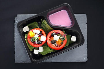 Image showing Dietary catering, vegetable stuffed tomatoes with yoghurt sauce.