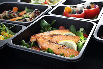 Image showing Lunch boxes, delicious and healthy dinner dishes.Dinner dishes in boxes.